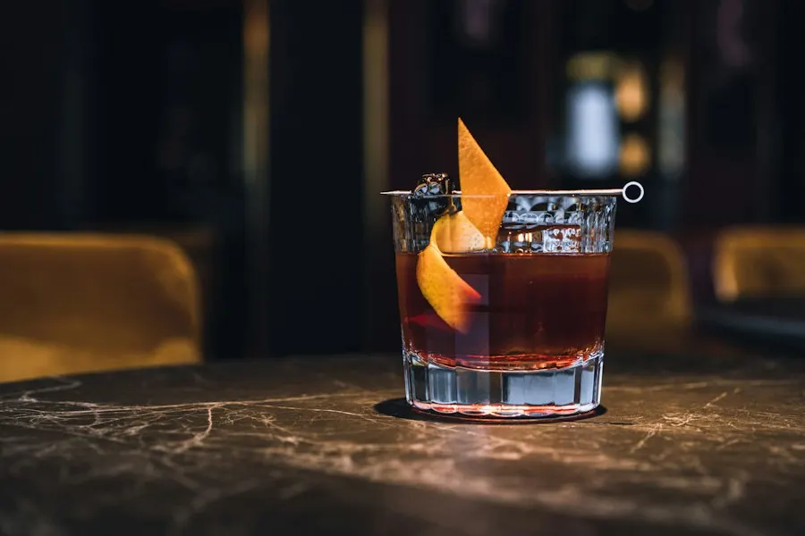 A smoked old fashioned on the marble bar
