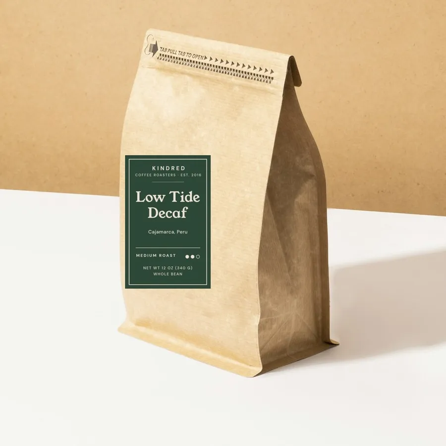 Low Tide Decaf coffee in a kraft bag with a medium roast label