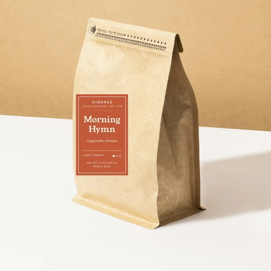 Morning Hymn coffee in a kraft bag with a light roast label