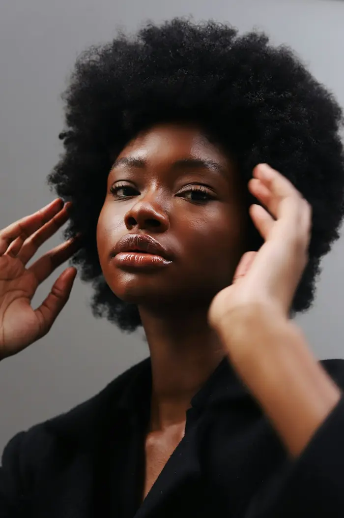 Woman with a rounded natural afro shape